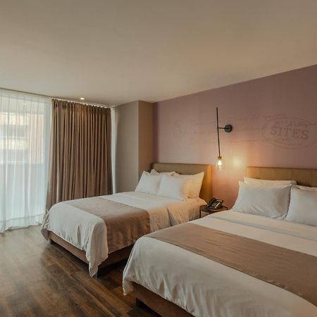 Sites Hotel Medellín Exteriér fotografie A room at the hotel