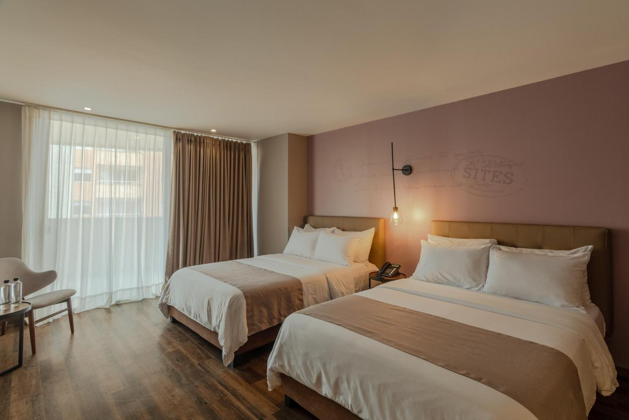 Sites Hotel Medellín Exteriér fotografie A room at the hotel